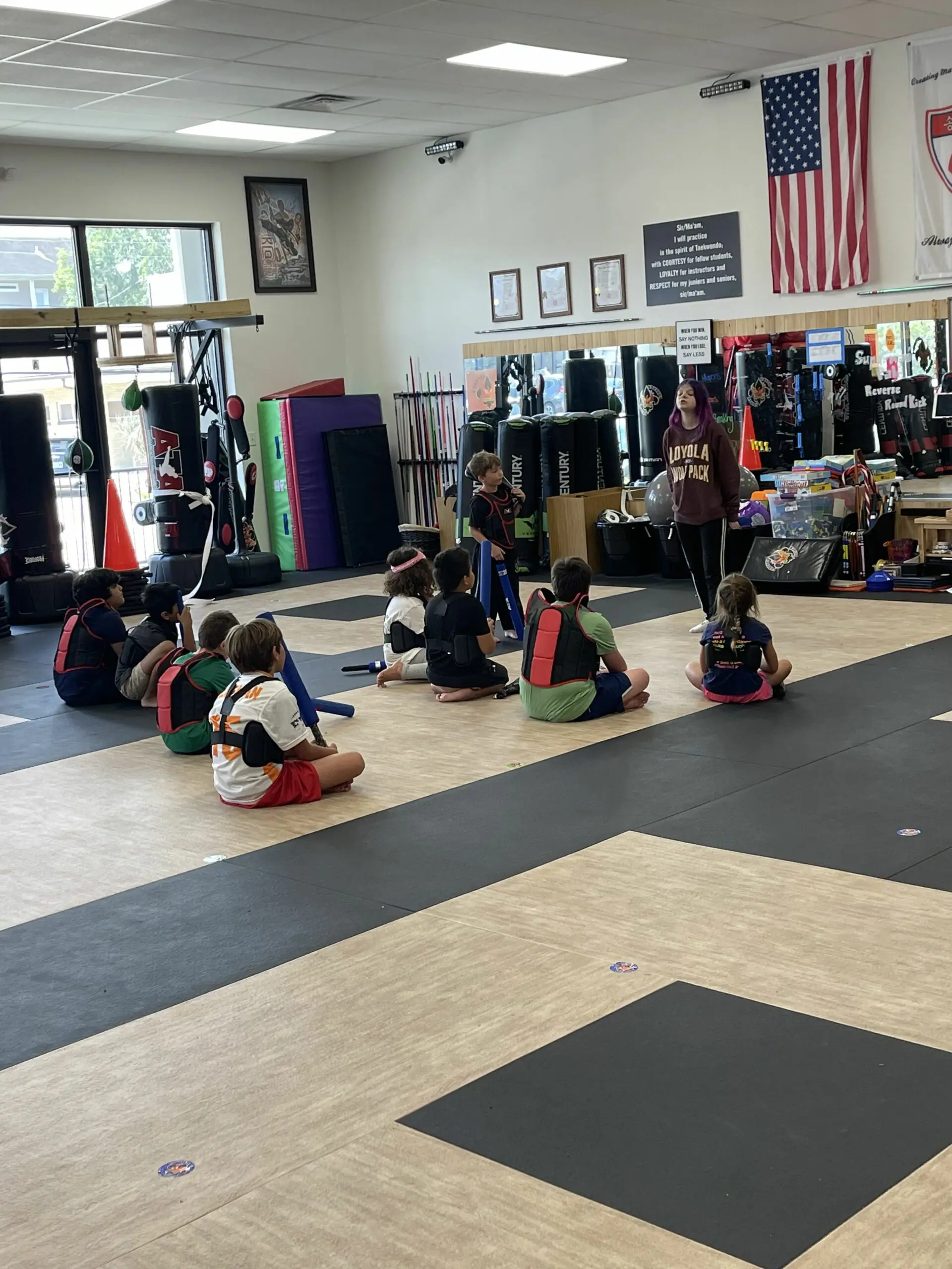 Kids participating in active indoor games during Forever Driven Summer Camp